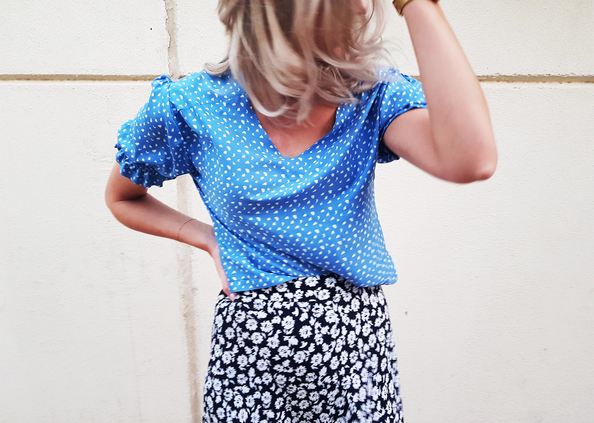 blue top with puff sleeves